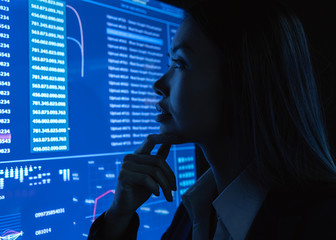 The businesswoman look on the blue monitor