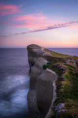 Sunset at stunningTunnel beach, New Zealand