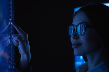 The young business woman touches sensor surface