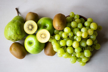 Pineapple, apple, pear, grapes, melon and Avocado