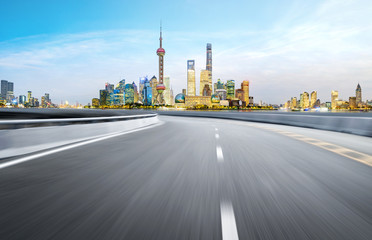 Naklejka na ściany i meble Dynamic blurry highway and city skyline in Shanghai, China