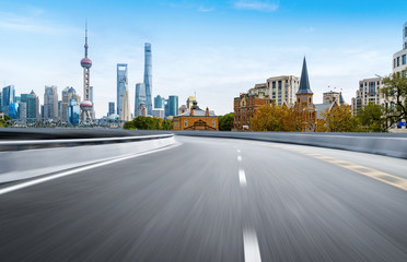 Fototapeta na wymiar Dynamic blurry highway and city skyline in Shanghai, China
