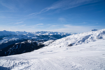 Fototapeta na wymiar Group Of People Doing Skiing Near Mountains