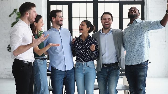 Excited happy multiethnic business team people celebrate corporate success