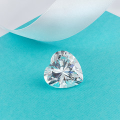 Heart Shaped Diamond on Turquoise Background 