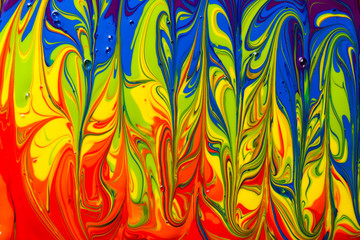 Abstract background of a rainbow of multicolored paint swirls