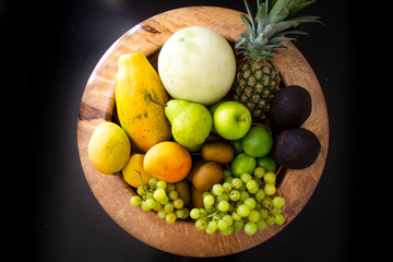 Pineapple, apple, pear, grapes, melon, honeymelon and Avocado
