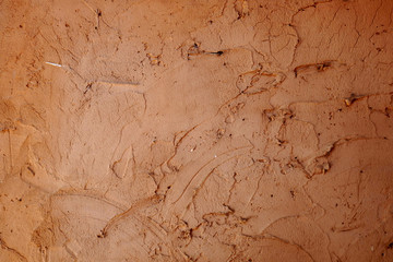 cracked brown cement wall background, clay wall texture, concrete stone
