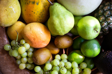 Pineapple, apple, pear, grapes, melon, honeymelon and Avocado