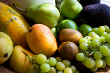 Pineapple, apple, pear, grapes, melon, honeymelon and Avocado