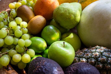 Pineapple, apple, pear, grapes, melon, honeymelon and Avocado