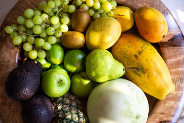 Pineapple, apple, pear, grapes, melon, honeymelon and Avocado