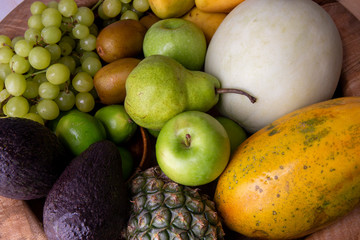 Pineapple, apple, pear, grapes, melon, honeymelon and Avocado