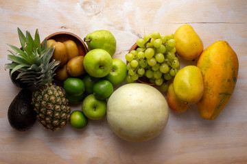 Pineapple, apple, pear, grapes, melon, honeymelon and Avocado