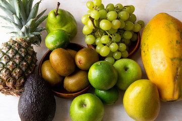 Pineapple, apple, pear, grapes, melon, honeymelon and Avocado