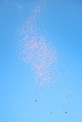 red confetti in the blue sky