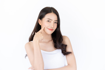 Young asian woman has smiling face and bright skin tone.Asian woman standing with isolated white background. © harit