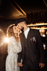 Attractive couple near the bar with beautiful light 