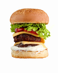 Big double homemade hamburger isolated on white background.