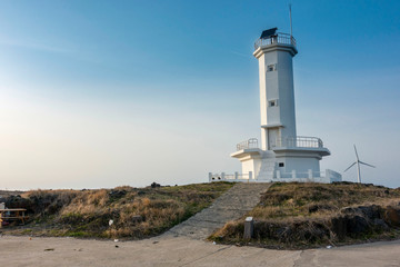 Fototapeta na wymiar Shinchang Wind Farm Lighthouse in Jeju island