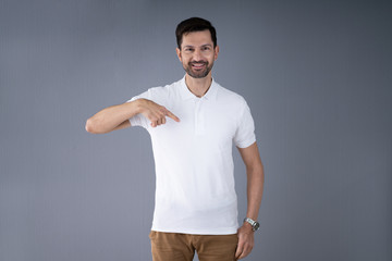 Smiling Man In Casuals Standing