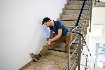 Man Sitting On Staircase