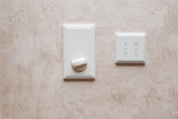 Air conditioning or heating system analog controller on the wall.