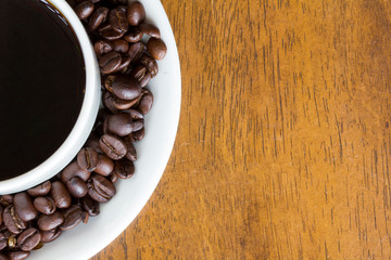 Hot coffee cup and coffee beans
