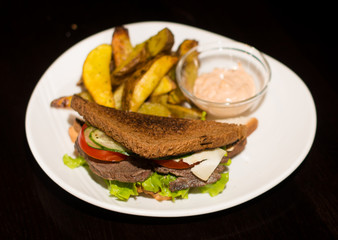 sandwich with beef and fried potatoes