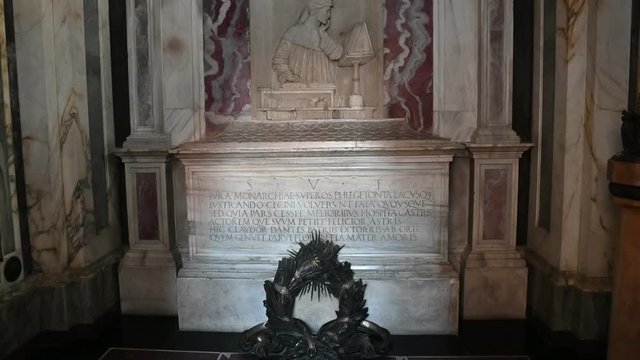Ravenna, Italy, December 2019. Footage on Dante's tomb. Neoclassical sepulcher of the poet Dante Alighieri at the basilica of San Francesco in the center. Tilt on the marble sepulcher