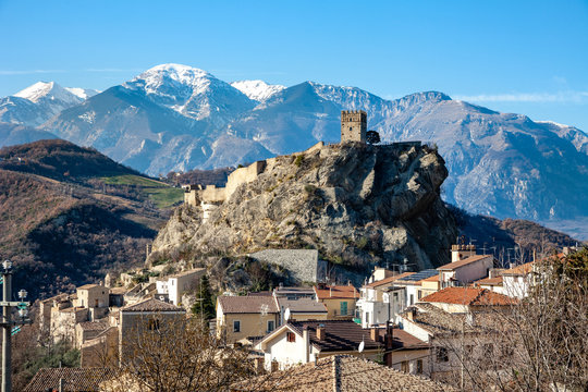 The medieval castle of Roccascalegna with the snow-covered Maiella massif in the background. Defensive bastion built on a cliff. Chieti, Abruzzo, Italy, Europe