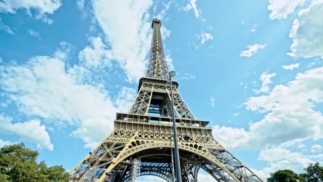 Eiffel Tower, Paris, France. Approaching to Famous Monument and Landmark on Sunny Summer Day With Beautiful Sky