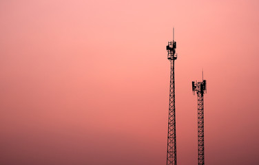 Antenna broadcast signal telecommunication in an pink orange sky background - obrazy, fototapety, plakaty