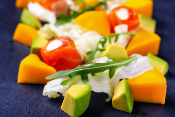 salad with salmon mango avacado and arugula3