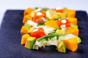 salad with salmon mango avacado and arugula2