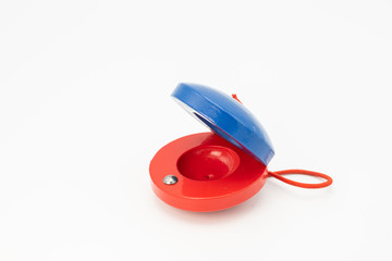 Colorful castanets for children red and blue - obrazy, fototapety, plakaty