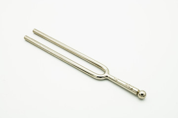 A tuning fork 440 Hz on a white background