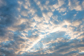 Evening light with clouds and blue sky.