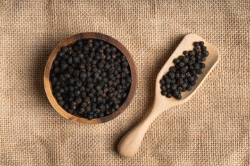 Fresh black cambodian pepper corn in bowl, cooking preparation