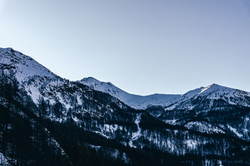 Fototapeta premium The mountains of the Aosta Valley during the dawn of a winter day near the Matterhorn and the village of Valtournenche, Italy - December 2019.