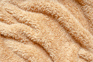 Natural fiber thermal fur wool texture background from sheep with white bright color tone. Backdrop for design art work or text message.