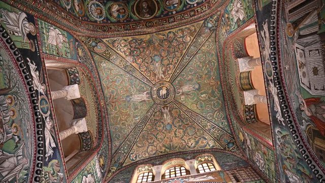 Ravenna, Italy, December 2019. Inside the basilica of San Vitale, footage with rotation movement on the vault decorated with magnificent mosaics.