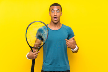 African American tennis player man with surprise facial expression