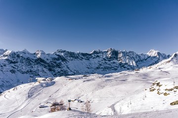 Fototapeta na wymiar The mountains of the Aosta Valley during a fantastic winter day near the Matterhorn and the town of Breuil-Cervinia, Italy - December 2019.