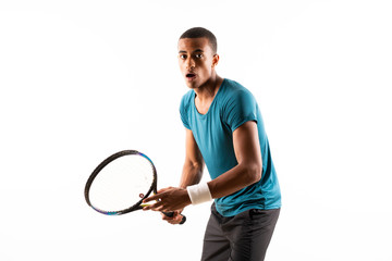 Afro American tennis player man over isolated white background .