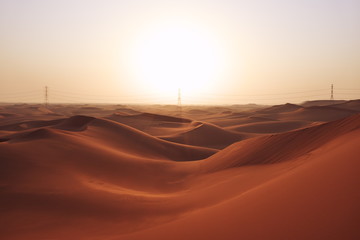 Fototapeta na wymiar Sunrise in the red desert sand dunes of the Arabian Desert in Riyadh, Saudi Arabia