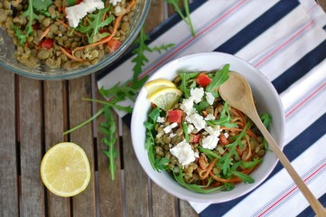Lentil salad with arugula, pepper, carrot, lemon and cheese