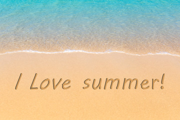 Fototapeta na wymiar I love summer written in a sandy tropical beach.