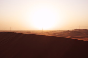 Fototapeta na wymiar Sunrise in the red desert sand dunes of the Arabian Desert in Riyadh, Saudi Arabia