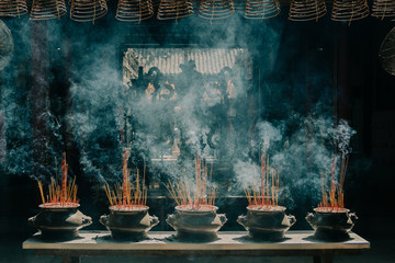 incense burning in a moody temple